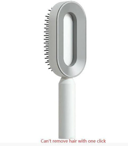 Mandotos self-cleaning hair brush with scalp massage features, shown with ergonomic handle and bristles for gentle scalp care.