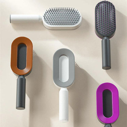 Mandotos self-cleaning hair brush with scalp massage features, showing the brush head and ergonomic handle for easy grooming.