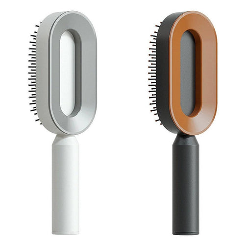 Mandotos self-cleaning hair brush with scalp massage feature and one-click cleaning, showing the ergonomic handle and bristles.