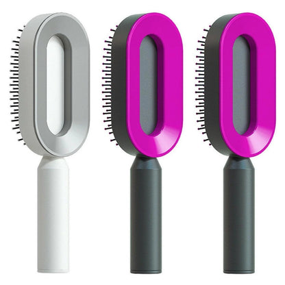 Mandotos self-cleaning hair brush with scalp massage feature, showing the ergonomic handle and bristles for gentle scalp care.
