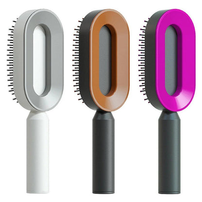 Mandotos self-cleaning hair brush with scalp massage feature, showing ergonomic design and cleaning mechanism in action.