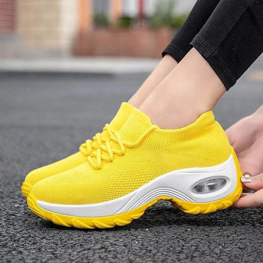 Mandotos women's sports shoes with flying knit sock design, lightweight and flexible for active wear.