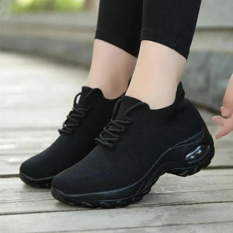 Mandotos women's sports shoes with flying knit design and shaking sole, lightweight athletic footwear for active wear.
