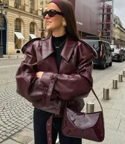 Mandotos sleek matte leather coat featuring a stylish design, smooth finish, and tailored fit, perfect for a modern wardrobe.
