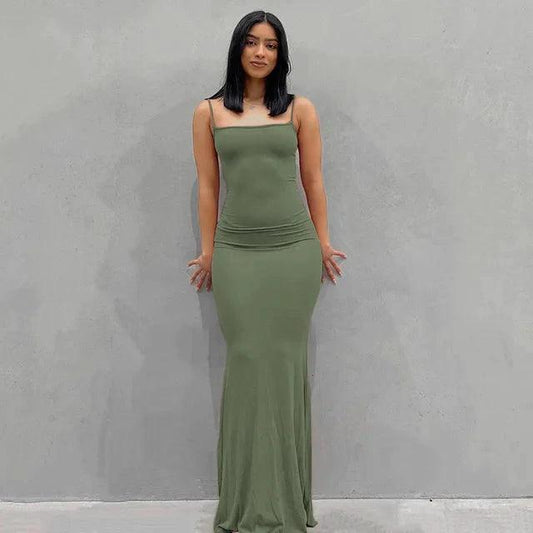 Mandotos sleek satin backless gown showing a smooth, flowing fabric and elegant backless design for formal occasions.