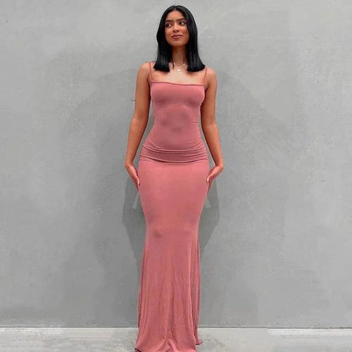 Mandotos sleek satin backless gown with a fitted silhouette, smooth fabric, and elegant design perfect for formal occasions.