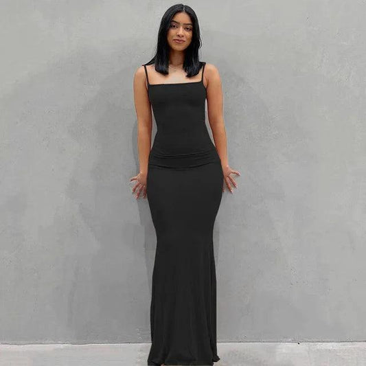 Mandotos sleek satin backless gown featuring smooth fabric and elegant design, perfect for formal occasions.