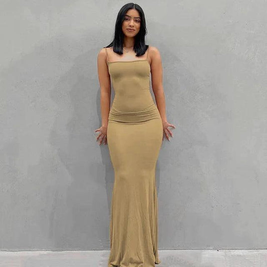 Mandotos sleek satin backless gown draped elegantly, featuring a fitted silhouette and smooth satin fabric for formal occasions.
