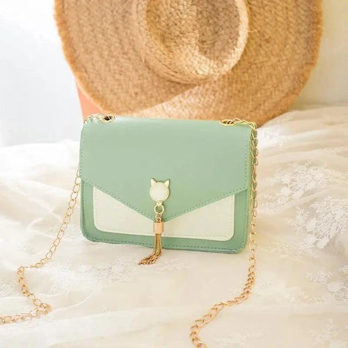 Mandotos small women's crossbody bag with cat lock chain and messenger style, stylish and compact for everyday use.