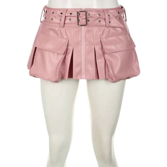 Mandotos Spice faux leather pleated mini skirt hanging on a hanger, showcasing its textured fabric and stylish design.