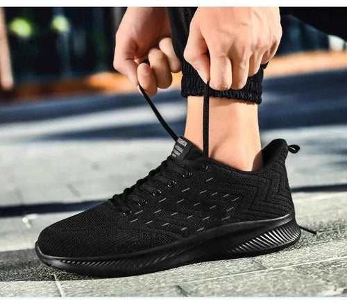 Mandotos Sports Flying Woven Cold Sticky Ultralight Casual Running Shoes showing woven fabric upper and sleek athletic design