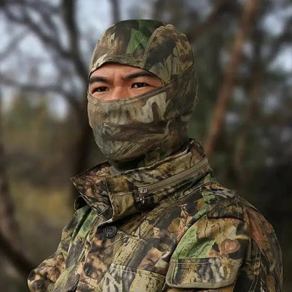 Mandotos Stealth Ops camo face mask with black and green camouflage pattern, made of breathable fabric for outdoor activities.