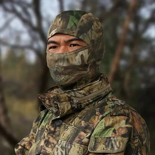 Mandotos Stealth Ops camo face mask with black and green camouflage pattern, made of breathable fabric for outdoor activities.