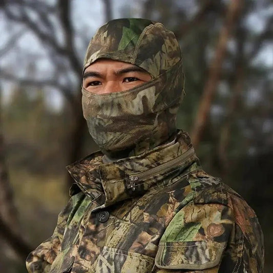 Mandotos Stealth Ops camo face mask with black and green camouflage pattern, made of breathable fabric for outdoor activities.