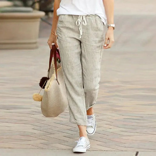 Light beige Summer Elegance drawstring trousers by MANDOTOS, featuring a relaxed fit and lightweight fabric for warm weather.