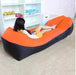 Mandotos SunScape Inflatable Lounger in vibrant orange with built-in pillow, designed for outdoor relaxation and effortless comfort.