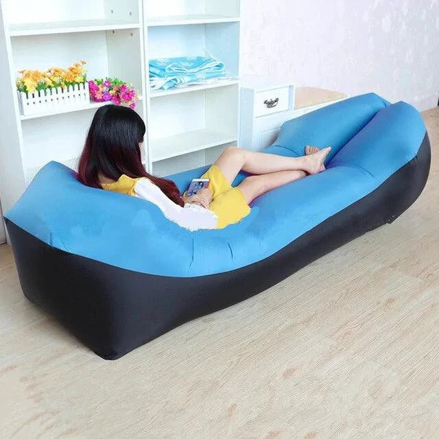 Mandotos SunScape inflatable lounger filled with air, showcasing a portable outdoor relaxation chair on a grassy area.