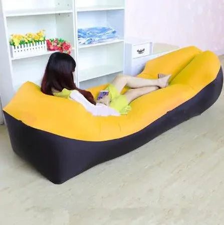Mandotos SunScape inflatable lounger outdoors, showing its lightweight, portable design and comfortable seating for relaxation.