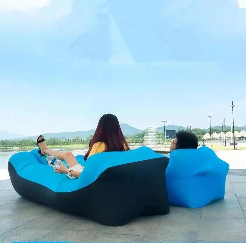 Mandotos SunScape Inflatable Lounger in vibrant orange, showcasing its compact, portable design for outdoor relaxation.