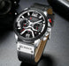 Mandotos Tactical Elegance leather watch with black dial, stainless steel case, and brown leather strap on a minimalist background.
