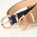 Mandotos Tally vegan leather belt with adjustable buckle, showcasing smooth black vegan leather and sleek design.