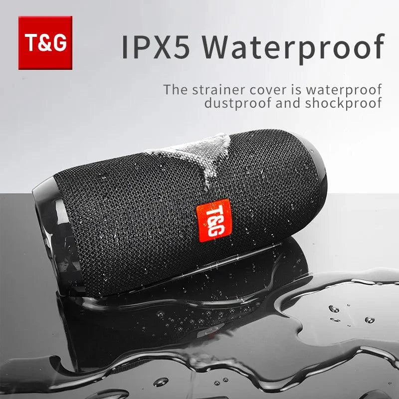 Mandotos TG117 Bluetooth portable waterproof TWS outdoor speaker on a surface, showing compact design and control buttons.
