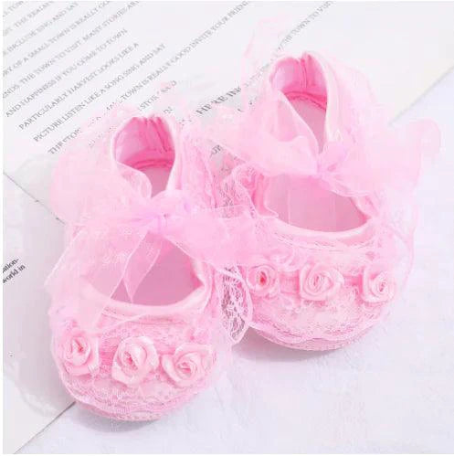 Pink toddler shoes by MANDOTOS with soft fabric and Velcro straps, suitable for young children and small feet.