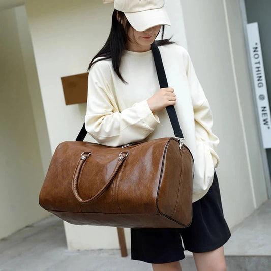 Mandotos travel bag for men and women, stylish PU leather shoulder bag with large capacity, duffle, crossbody, and sports pack features.
