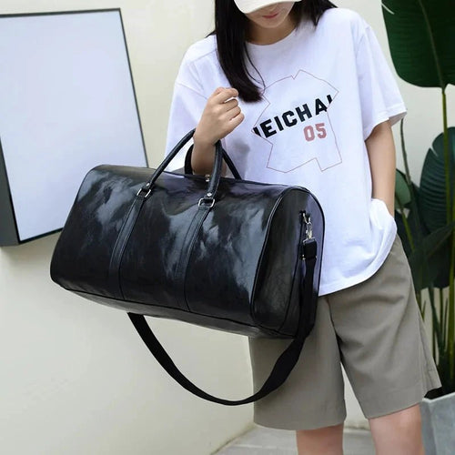 Mandotos PU leather travel bag for men and women with large capacity, shoulder strap, and versatile duffle and crossbody design.