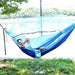 Mandotos Traveler's Mosquito-Free Hammock with net and durable fabric for outdoor camping and relaxing in nature.