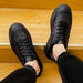 Mandotos trendy leather men's casual sneakers, stylish and comfortable footwear with a modern design and lace-up closure.