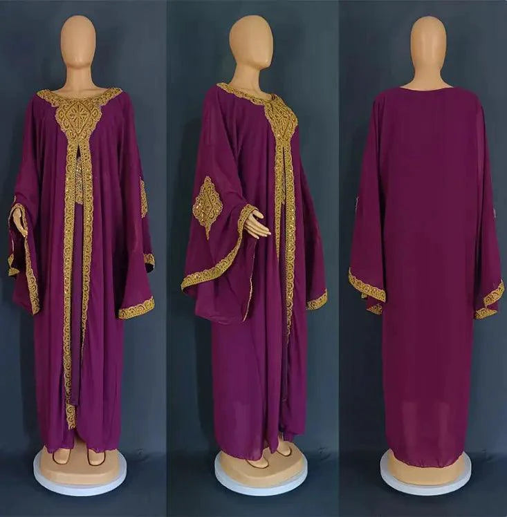 Gold two-piece kaftan abaya dress by MANDOTOS, featuring flowing fabric and elegant design, seen on a model.
