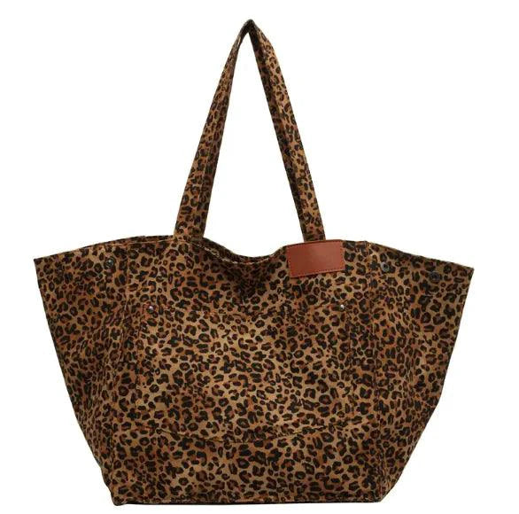 Urban Leopard Canvas Tote by MANDOTOS featuring a stylish leopard print design on durable canvas fabric.