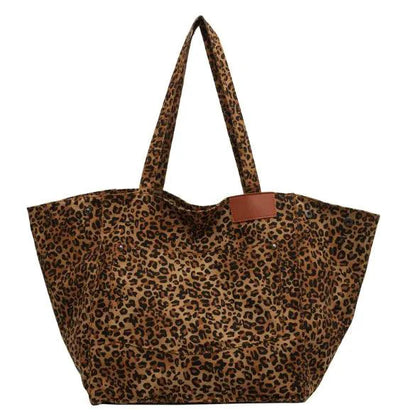 Urban Leopard Canvas Tote by MANDOTOS featuring a stylish leopard print design on durable canvas fabric.