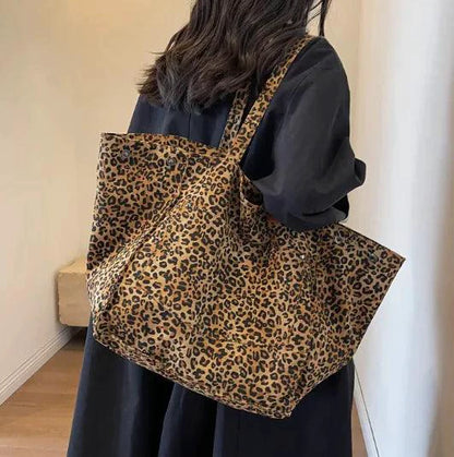 Mandotos Urban Leopard Canvas Tote bag with leopard print design, sturdy handles, and spacious interior for everyday use.