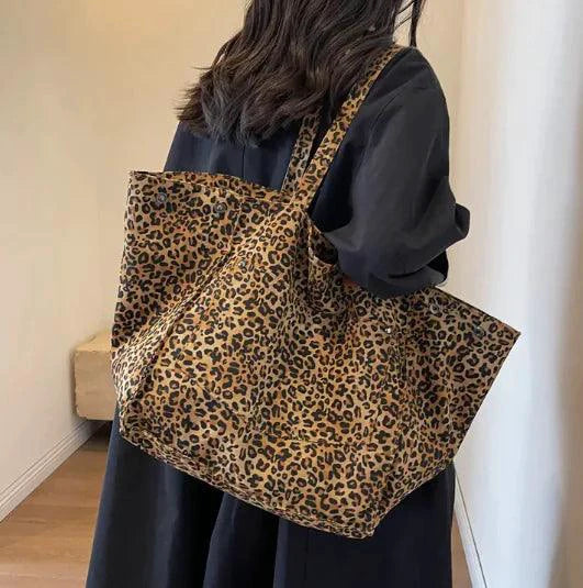 Mandotos Urban Leopard Canvas Tote bag with leopard print design, sturdy handles, and spacious interior for everyday use.