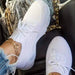 Mandotos walking shoes in black with white soles, featuring breathable mesh uppers and comfortable lacing for outdoor activities.