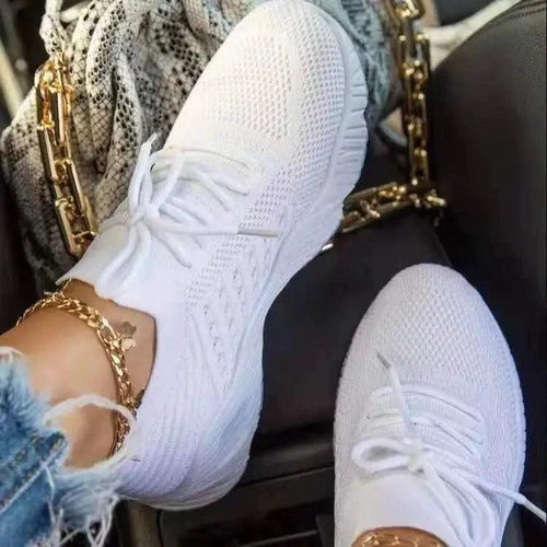 Mandotos walking shoes in black with white soles, featuring breathable mesh upper and comfortable lace-up design.