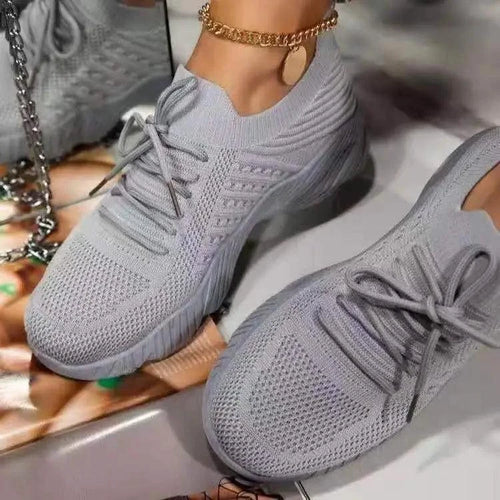 Mandotos walking shoes in black with white soles, featuring breathable mesh uppers and cushioned insoles for comfort.
