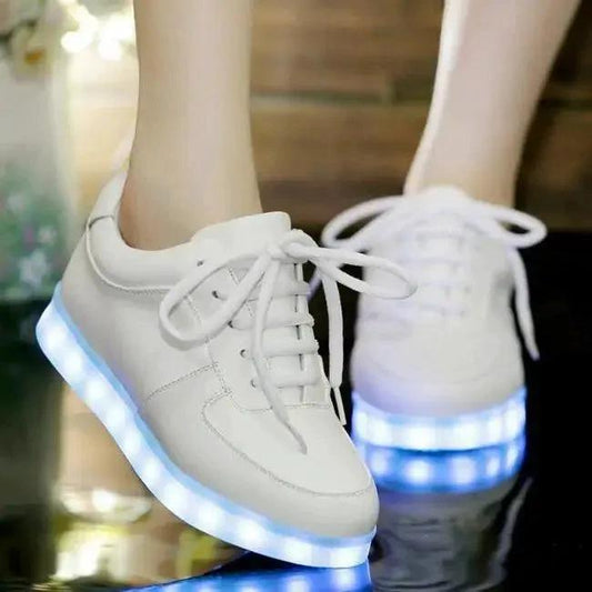 Mandotos white light-up shoes with illuminated soles for kids, featuring a sleek design and adjustable straps.