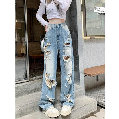 Plus size American Hole high waist straight-leg denim pants for women by MANDOTOS, showing the stylish fit and distressed details.
