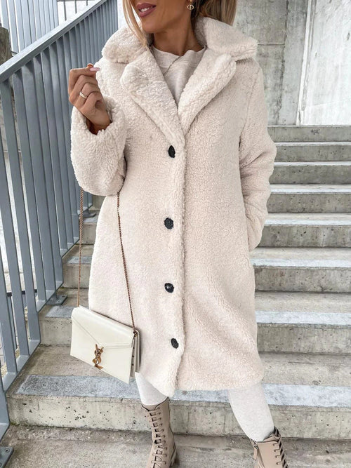 Women's lamb wool coat by MANDOTOS, featuring a stylish, warm design with a smooth wool exterior and tailored fit.