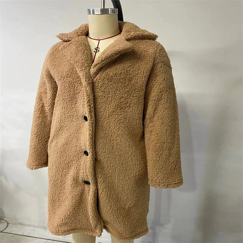 Women's lamb wool coat by MANDOTOS, featuring a cozy, stylish design with a tailored fit and classic collar in a neutral color.