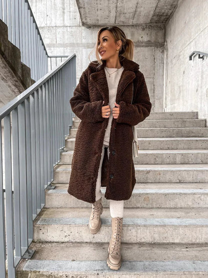 Women's lamb wool coat by MANDOTOS, shown in a stylish, cozy design with a classic fit and soft wool texture.