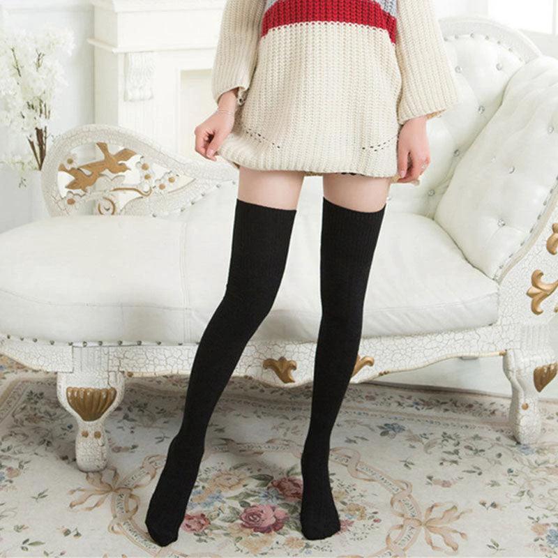 Women's warm knee-high socks by MANDOTOS in solid color, suitable for fashion and cold weather.