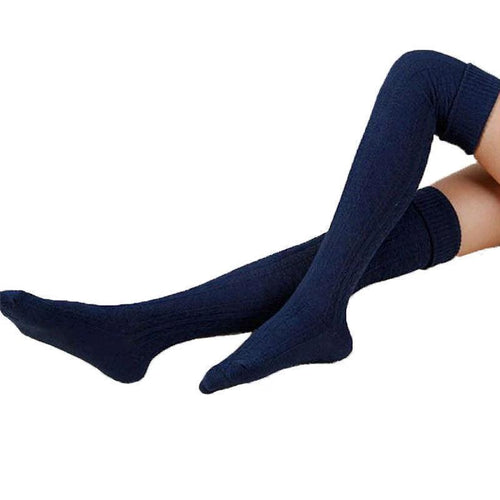 Women's warm knee-high socks by MANDOTOS in solid color, featuring cozy fabric and stylish design for cold weather comfort.