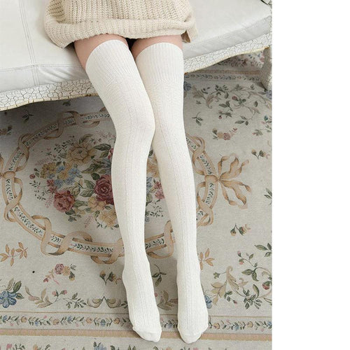 Women's solid color warm knee-high socks by MANDOTOS, designed for comfort and stylish winter wear.