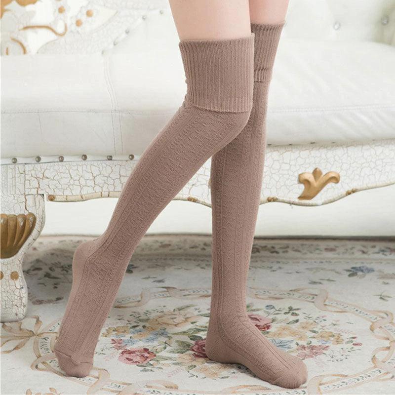 Mandotos women's solid color warm knee-high socks displayed on a model, perfect for stylish winter wear.
