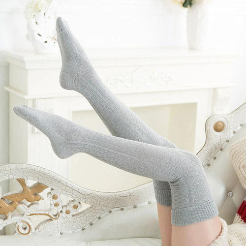 Mandotos women's warm knee-high socks in solid color, cozy and fashionable for stylish winter wear.