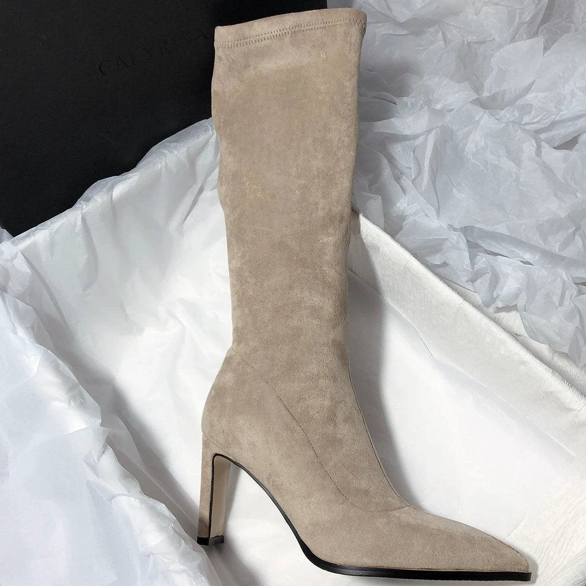 Women's high heel stretch below-the-knee boots by MANDOTOS, showcasing sleek black design and pointed toe detail.